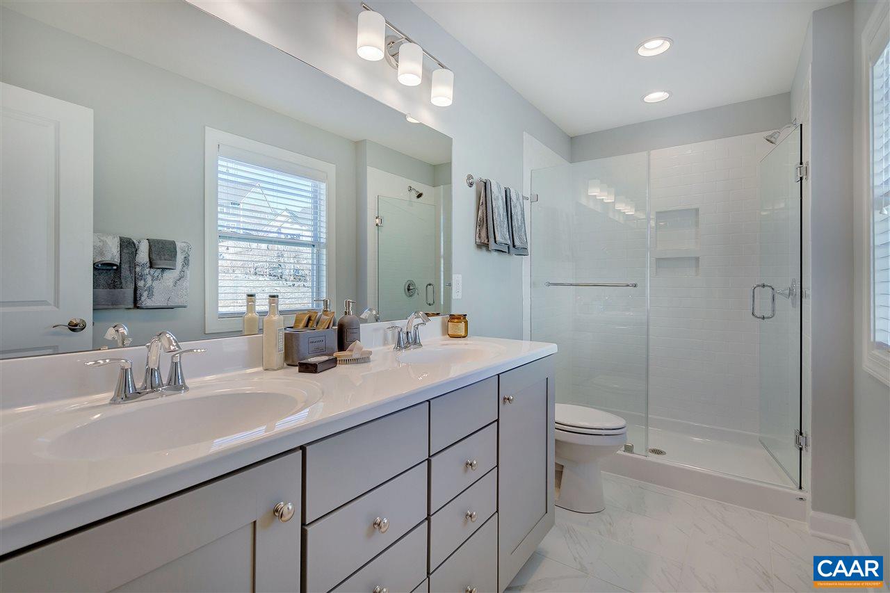 3134 Horizon Road Charlottesville, VA 22902 - Photo 15 of 21 a bathroom with a double vanity sink toilet and shower