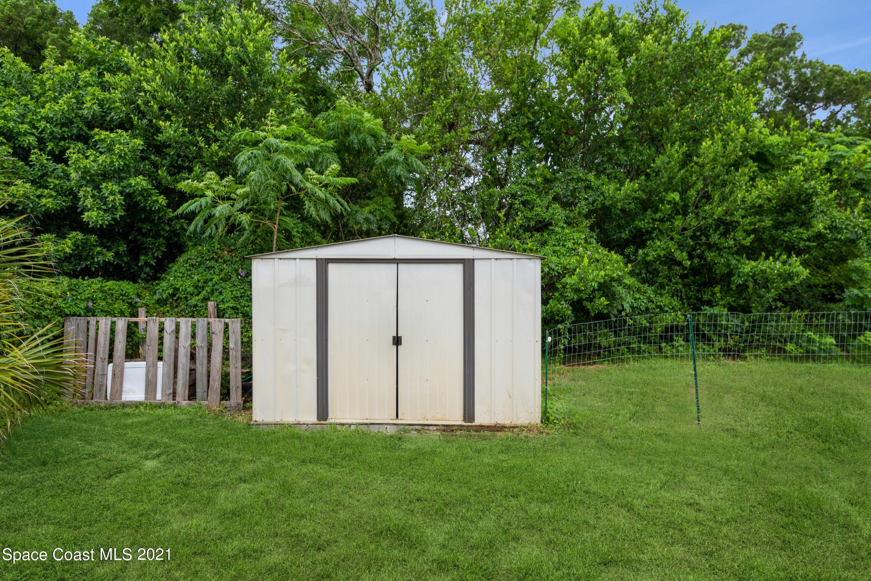2360 Dolphin Road Titusville, FL 32780 - Photo 26 of 29 Backyard/shed