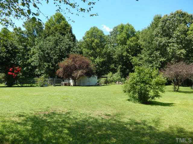 3151 Sanders Road Willow Spring, NC 27592 - Photo 23 of 24 a view of an outdoor space and a yard