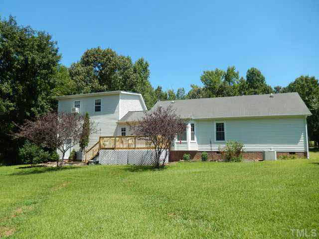 3151 Sanders Road Willow Spring, NC 27592 - Photo 24 of 24 a front view of house with yard and outdoor seating