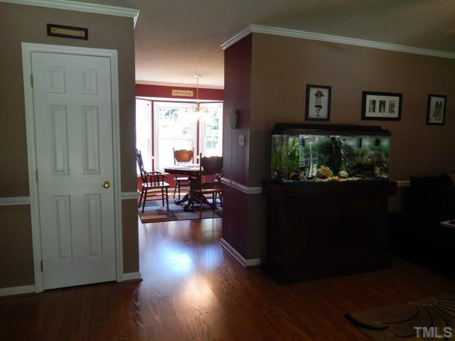 3151 Sanders Road Willow Spring, NC 27592 - Photo 8 of 24 a view of a livingroom with furniture wooden floor and a window