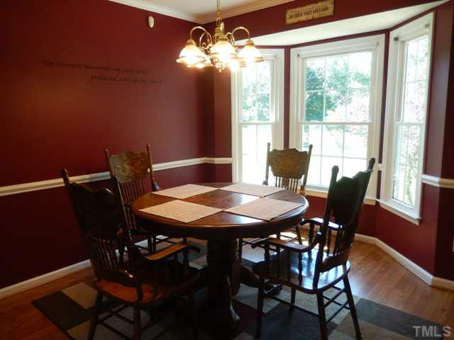 3151 Sanders Road Willow Spring, NC 27592 - Photo 9 of 24 a view of a dining room with furniture window and outside view