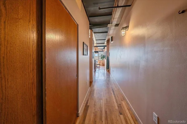 a view of gallery with wooden floor