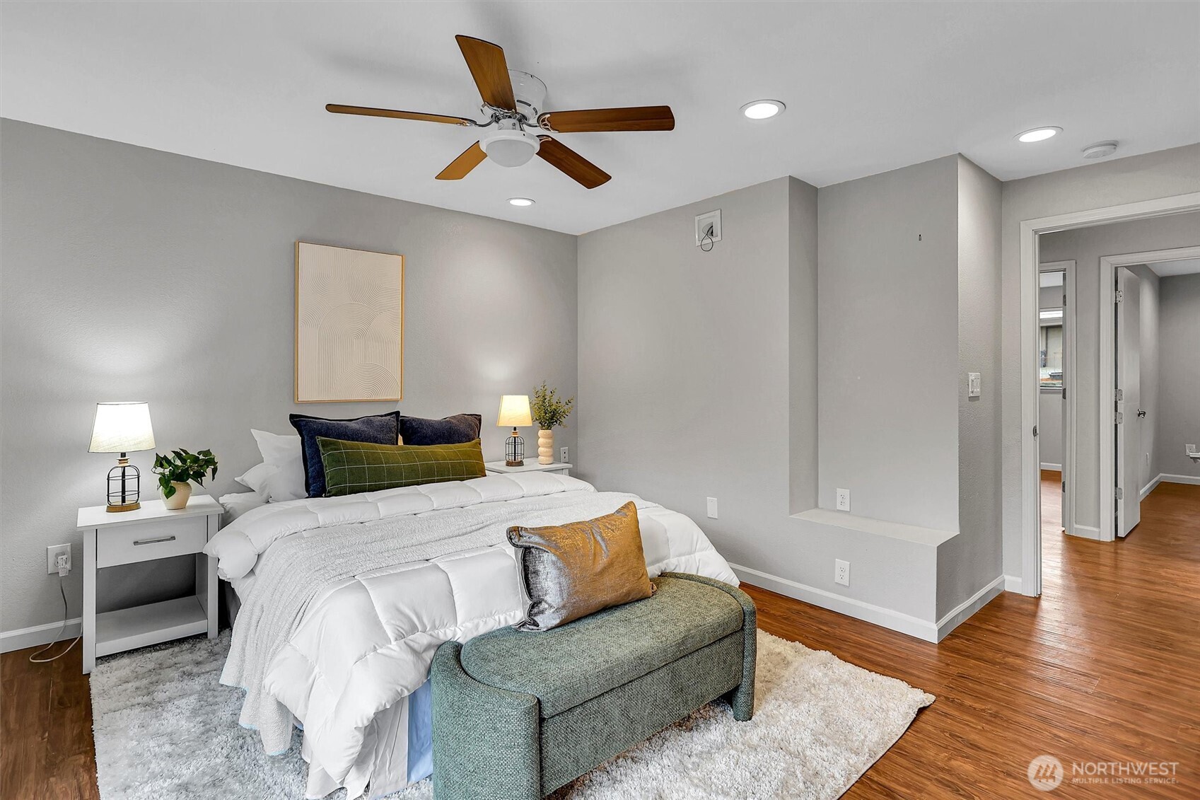 16825 17th Avenue Southeast Bothell, WA 98012 - Photo 12 of 37 a bedroom with a bed and a ceiling fan