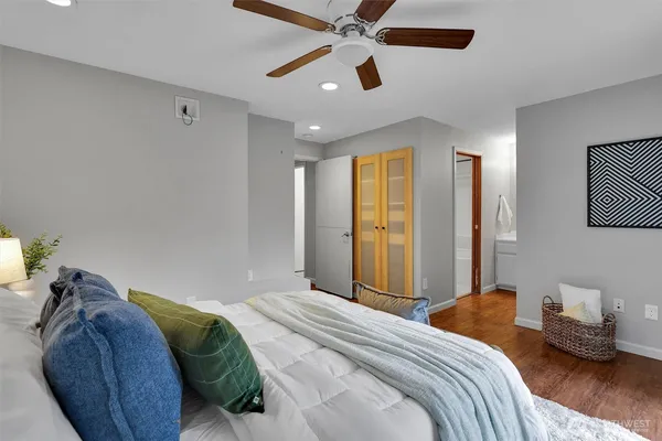 a bedroom with a bed and a chandelier