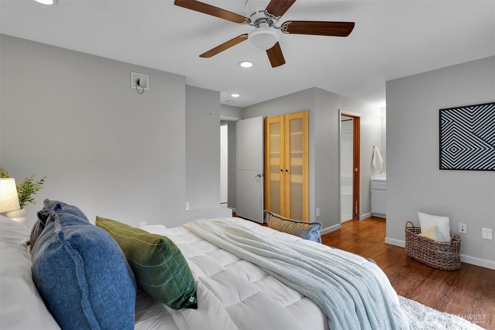 16825 17th Avenue Southeast Bothell, WA 98012 - Photo 13 of 37 a bedroom with a bed and a chandelier