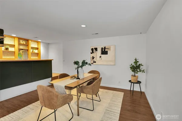 a view of a livingroom with furniture window and wooden floor