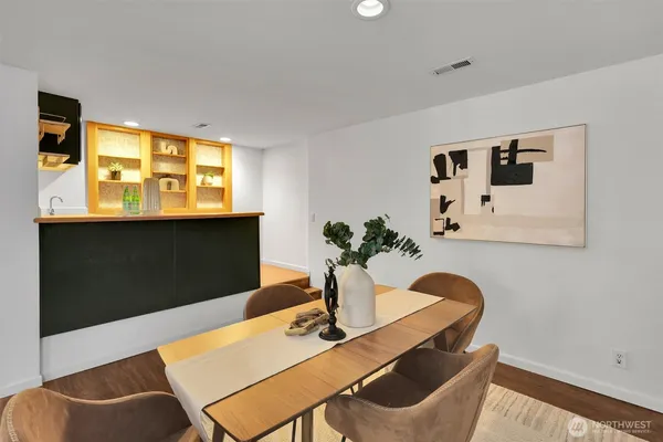 a dining room with furniture and window