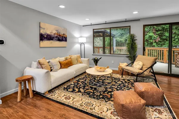 a living room with furniture and a rug