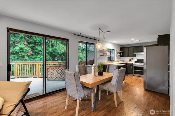a view of a dining room with furniture window and wooden floor