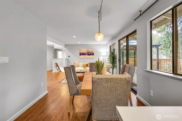 a living room with furniture a window and ceiling fan