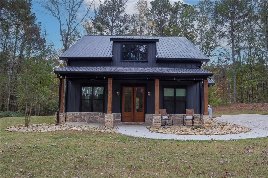 a view of a house with table and chairs
