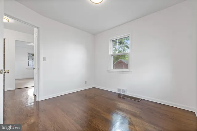 a view of a kitchen with wooden floor