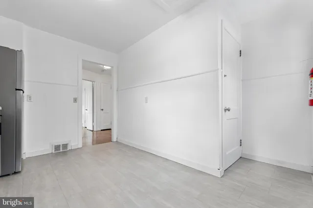 a view of backyard with a table and a chair