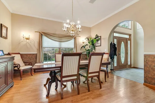 a bedroom with a bed and glass walk in closet