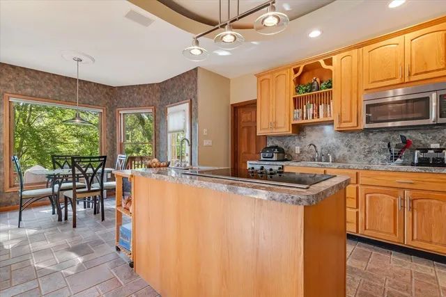 a bathroom with a sink and a window