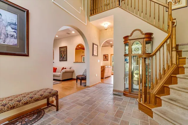 a view of a dining room with furniture and chandelier