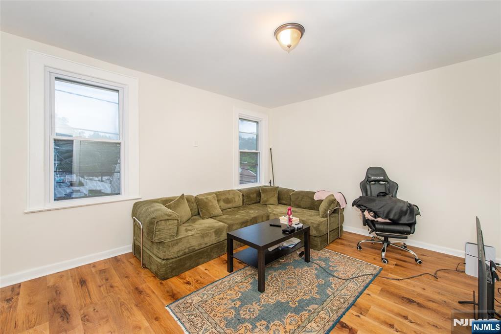 89 King Street Nutley, NJ 07110 - Photo 20 of 32 a living room with furniture and a window