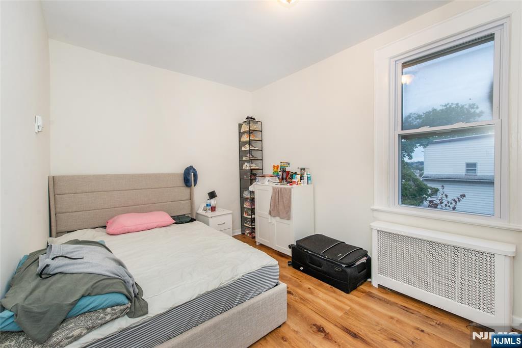 89 King Street Nutley, NJ 07110 - Photo 21 of 32 a bedroom with a bed and a window