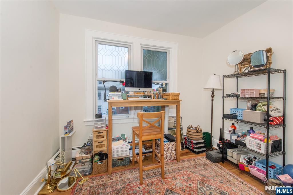 89 King Street Nutley, NJ 07110 - Photo 31 of 32 a room with furniture a rug and a window