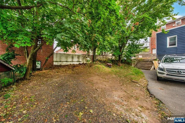 a view of a car parked in front of a house