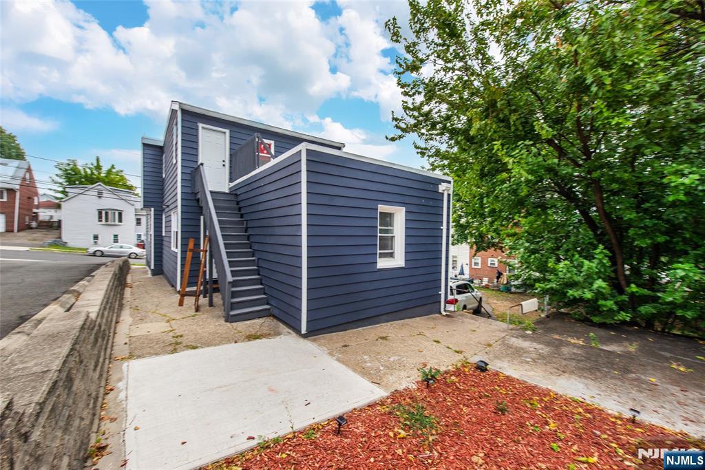 89 King Street Nutley, NJ 07110 - Photo 6 of 32 a front view of a house with a garage