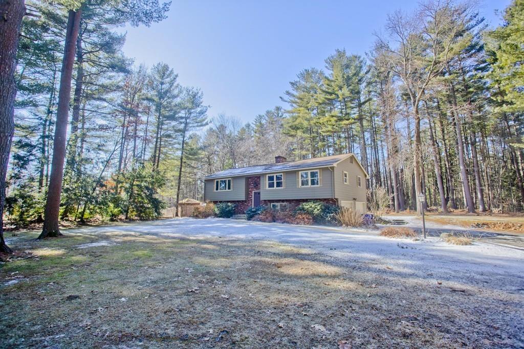 120 Strong Road Southampton, MA 01073 - Photo 1 of 25 a view of a house with trees in the background