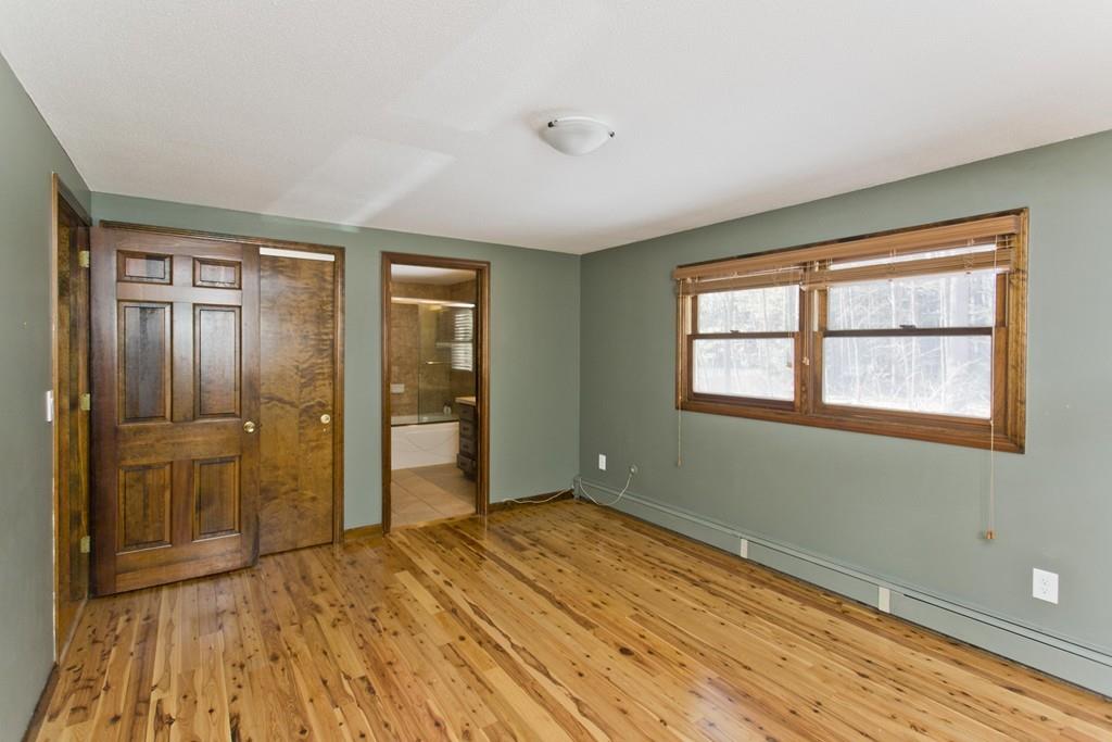120 Strong Road Southampton, MA 01073 - Photo 18 of 25 a view of an empty room with wooden floor and a window