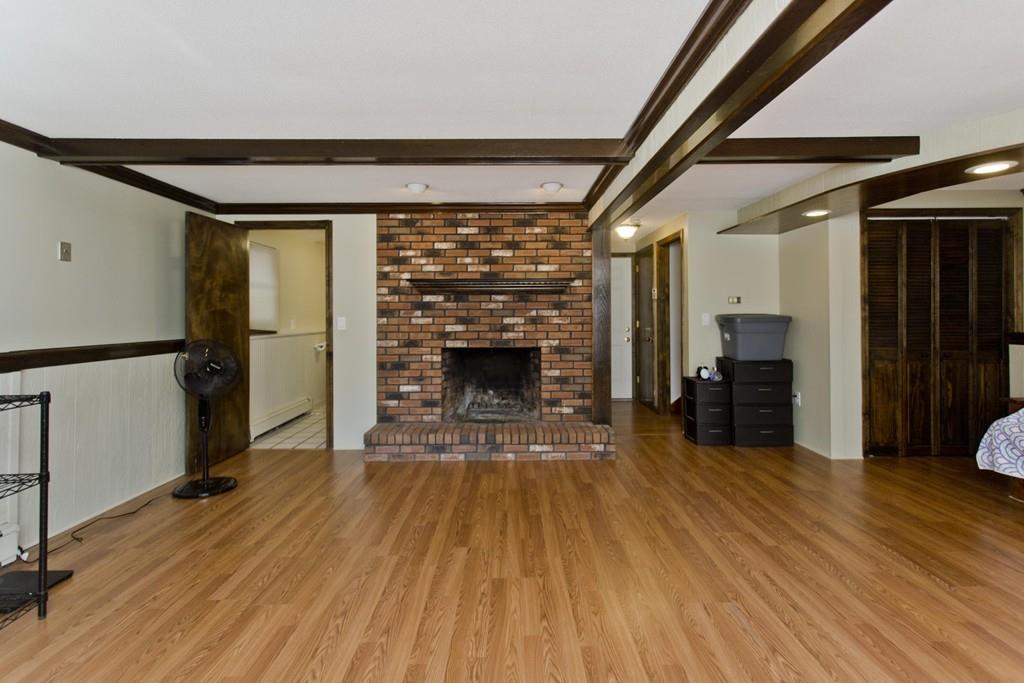120 Strong Road Southampton, MA 01073 - Photo 23 of 25 a view of a livingroom with wooden floor and a fireplace
