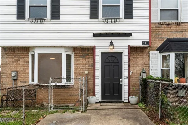 a front view of a house with parking