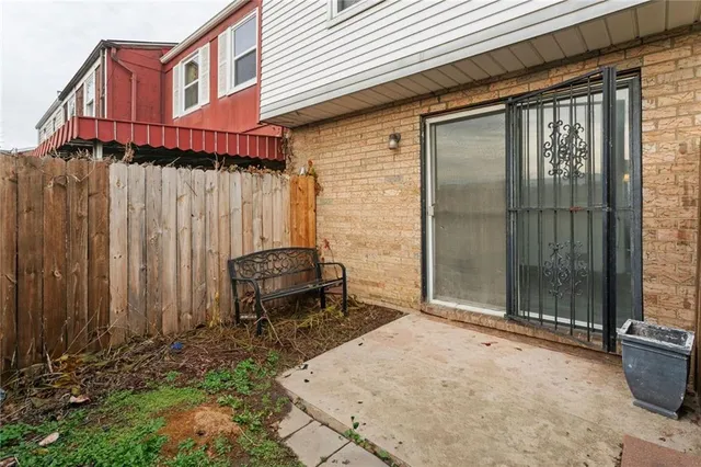 a view of a backyard with potted plants