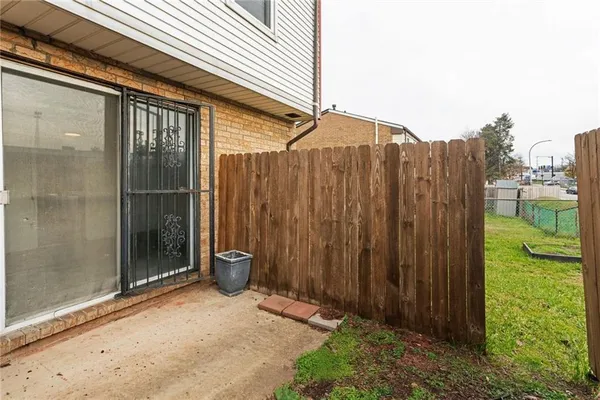 a view of a house with a backyard and a garden