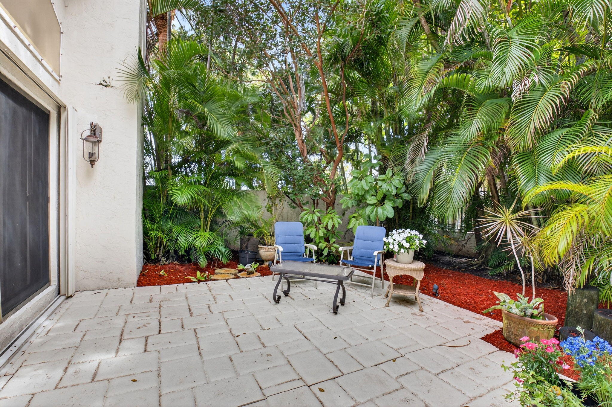 21700 Club Villa Terrace Boca Raton, FL 33433 - Photo 19 of 66 a lawn chairs sitting in a backyard of a house