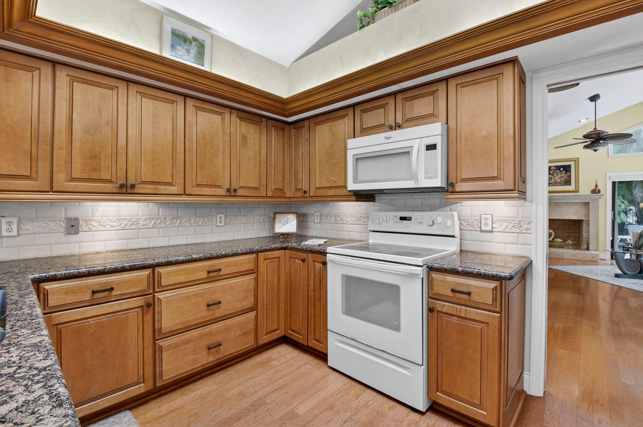 21700 Club Villa Terrace Boca Raton, FL 33433 - Photo 25 of 66 a kitchen with stainless steel appliances granite countertop a stove a sink and a microwave