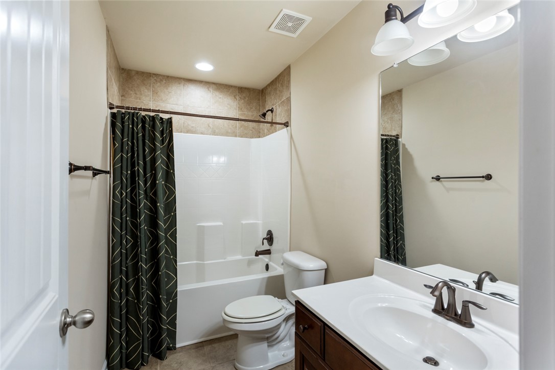 1005 Winmar Drive Anderson, SC 29621 - Photo 29 of 50 This clean and inviting bathroom features a convenient shower-tub combination and a practical vanity.