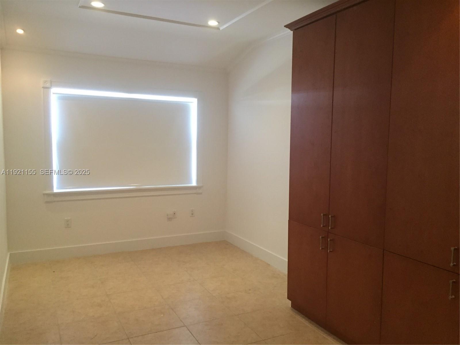 1831 Southwest 17th Terrace Miami, FL 33145 - Photo 14 of 21 an empty room with a window