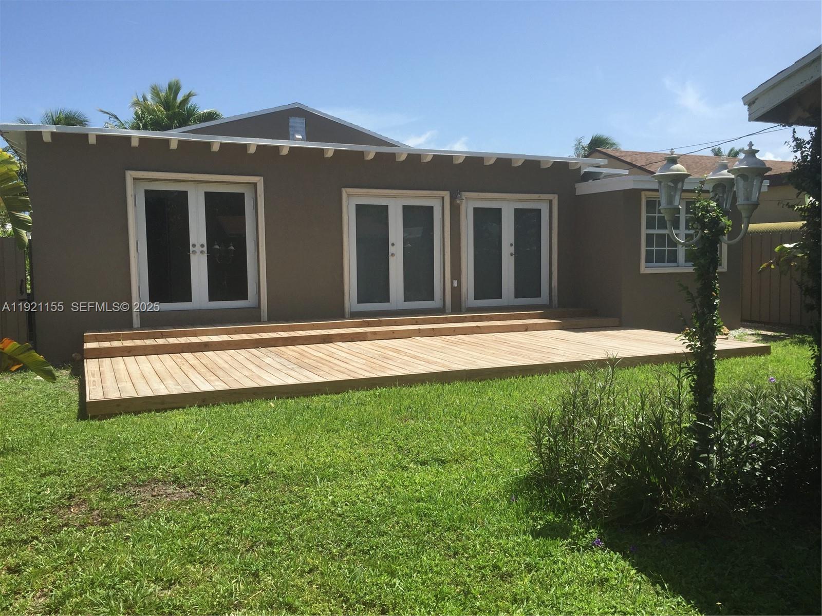 1831 Southwest 17th Terrace Miami, FL 33145 - Photo 20 of 21 a front view of a house with a yard
