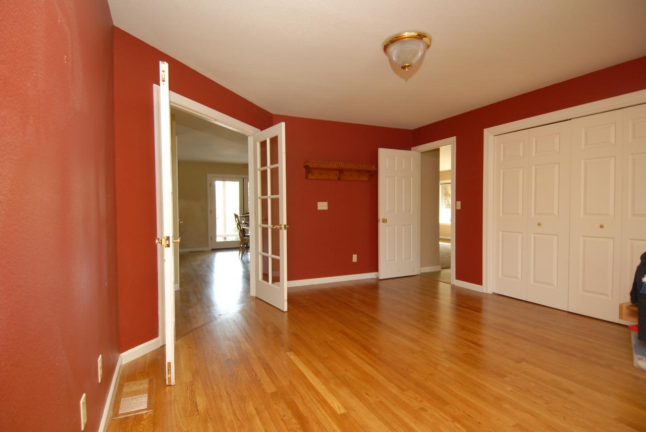 15855 Montgomery Ranch Road Redding, CA 96001 - Photo 12 of 12 a view of an empty room with wooden floor and a window
