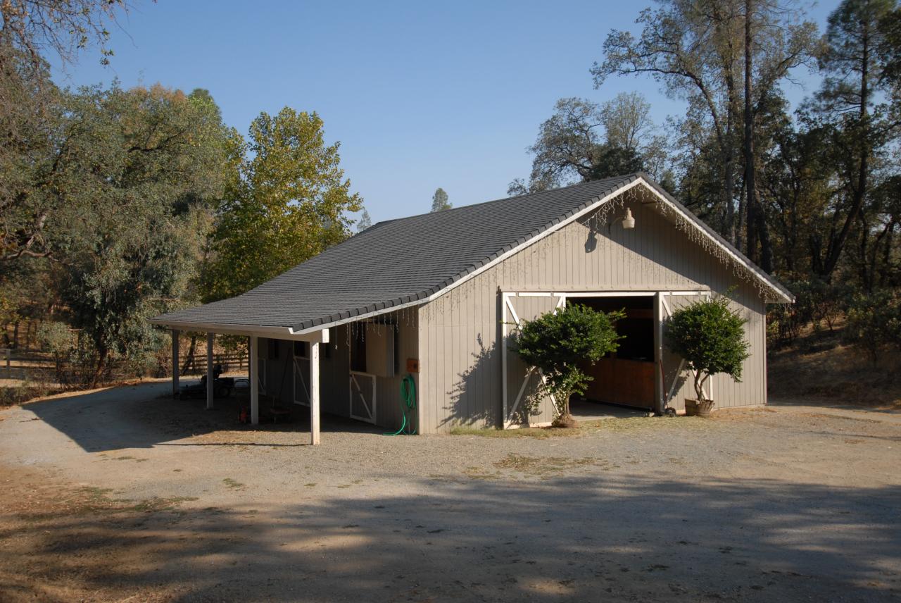 15855 Montgomery Ranch Road Redding, CA 96001 - Photo 4 of 12 a front view of a house with a yard