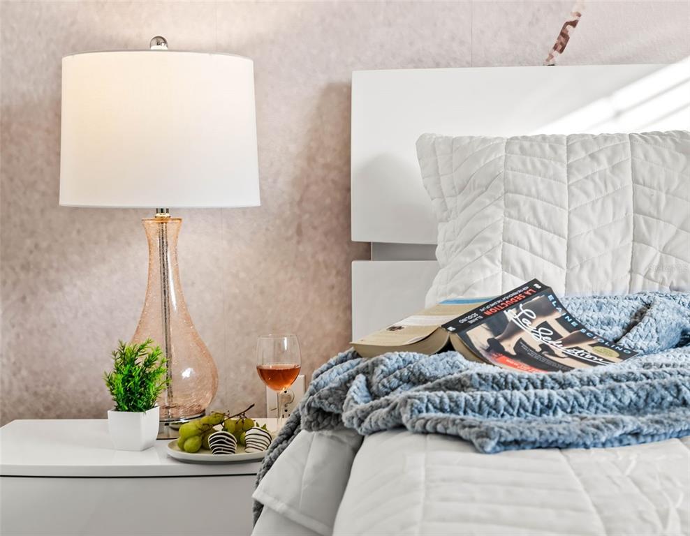 4895 Romeo Circle Kissimmee, FL 34746 - Photo 14 of 93 a bedroom with a bed and a lamp