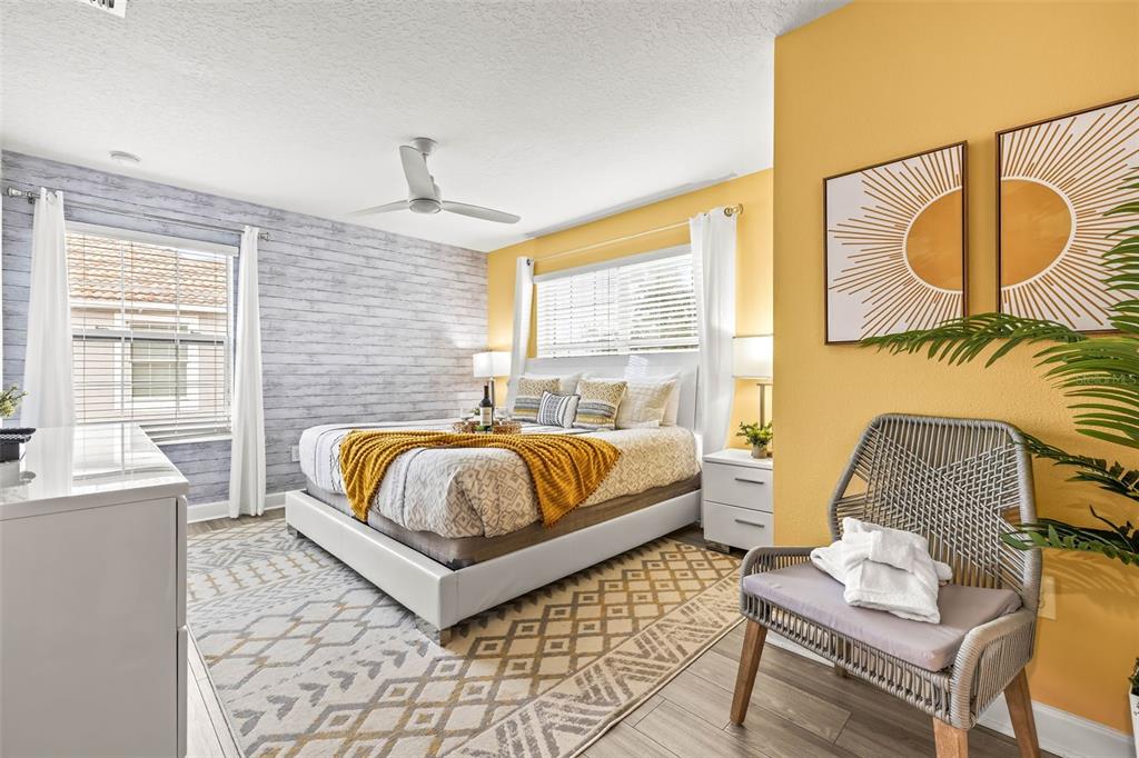 4895 Romeo Circle Kissimmee, FL 34746 - Photo 29 of 93 a bedroom with a bed and wooden floor