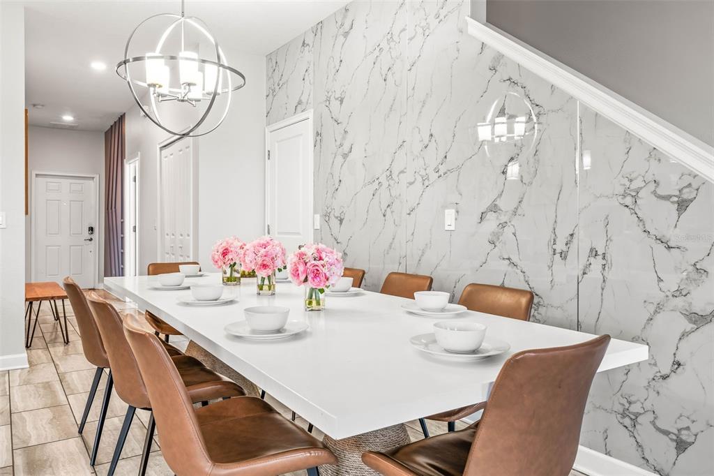 4895 Romeo Circle Kissimmee, FL 34746 - Photo 3 of 93 a view of a dining room with furniture and chandelier