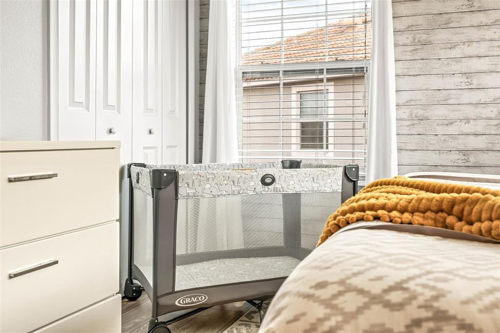 4895 Romeo Circle Kissimmee, FL 34746 - Photo 33 of 93 a bedroom with a bed and a window