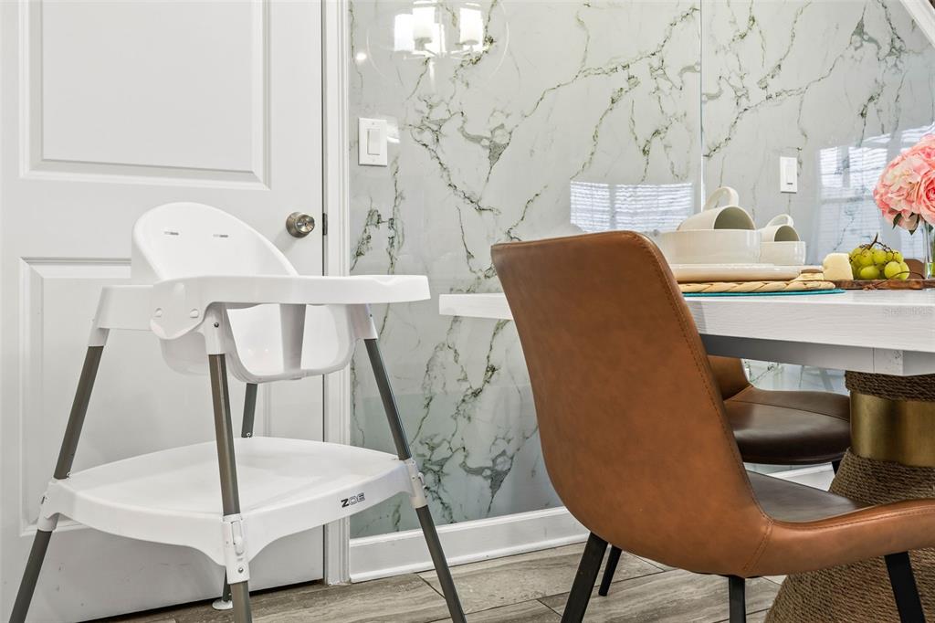 4895 Romeo Circle Kissimmee, FL 34746 - Photo 4 of 93 a view of a room with furniture and wooden floor