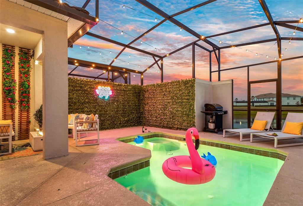 4895 Romeo Circle Kissimmee, FL 34746 - Photo 45 of 93 a swimming pool with yard of outdoor seating and swimming pool