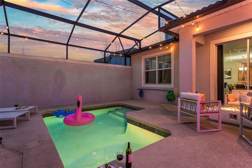 4895 Romeo Circle Kissimmee, FL 34746 - Photo 46 of 93 a view of a backyard with table and chairs