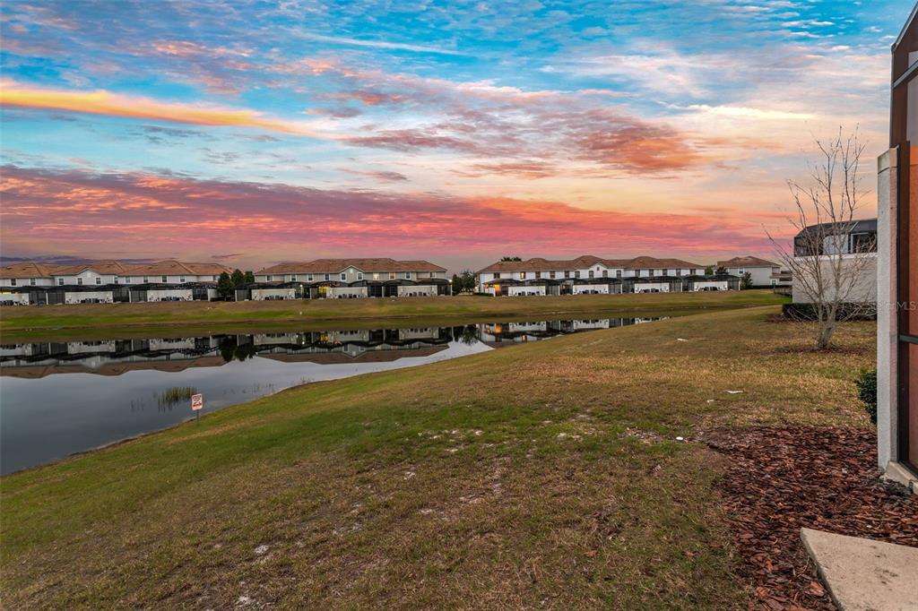 4895 Romeo Circle Kissimmee, FL 34746 - Photo 60 of 93 a view of a lake with houses in the back