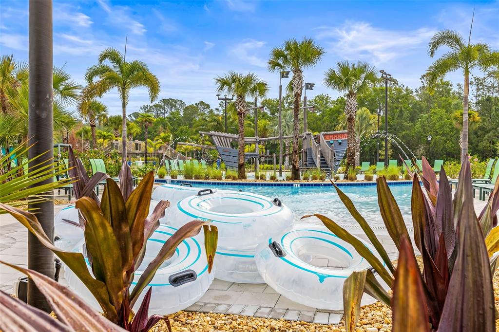 4895 Romeo Circle Kissimmee, FL 34746 - Photo 74 of 93 a view of swimming pool with seating area and garden