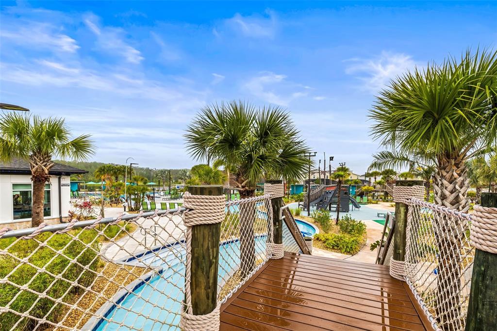 4895 Romeo Circle Kissimmee, FL 34746 - Photo 78 of 93 a view of a swimming pool with lounge chairs