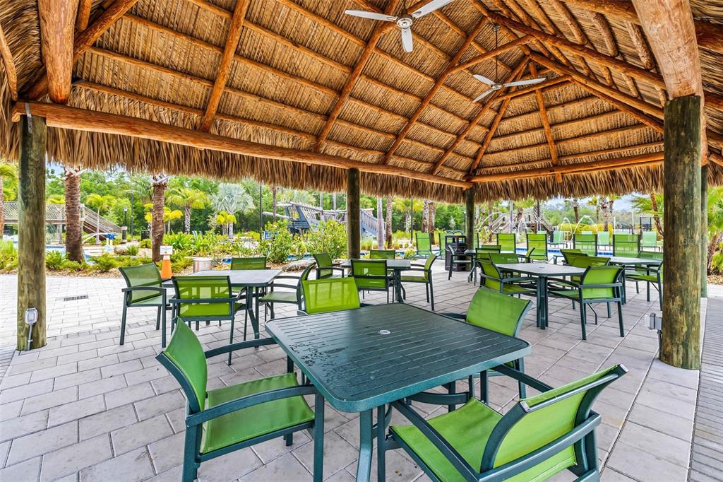 4895 Romeo Circle Kissimmee, FL 34746 - Photo 83 of 93 a view of a patio with a table chairs and a backyard